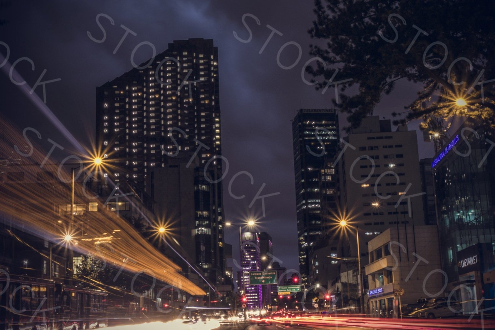 Before: Repeating STOCK text tiled across a night street scene
