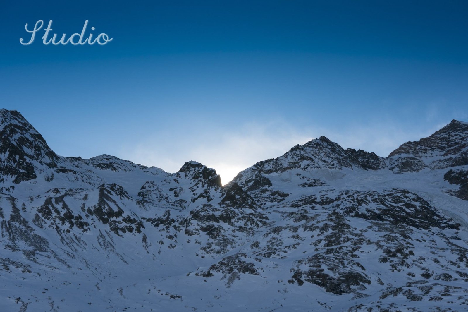 Before: A single script signature in the top left corner of a mountain scene